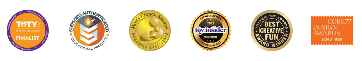 A row of six circular and rectangular award badges in orange, gold, purple, and white, including TOTY Finalist, ISO/IEC 27001 Certified, Men's Choice Award, Myinsider, Best Creative Fun Award Winner, and Core77 Design Awards Design Award.